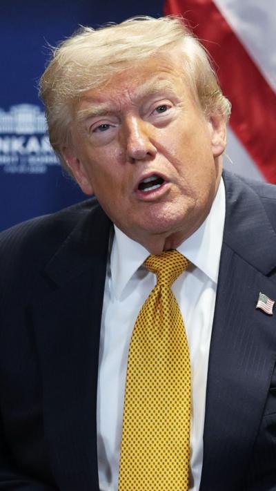 Donald Trump is talking to the press.