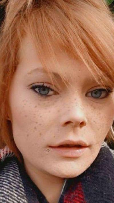 Woman with red hair and freckles