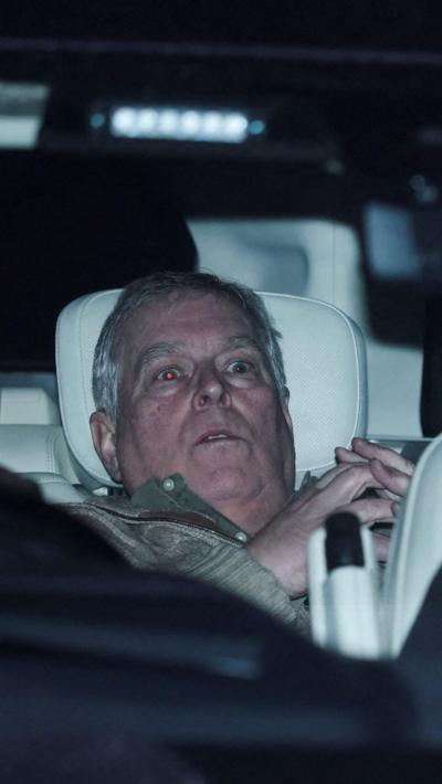 Andrew Windsor being driven away from a police station