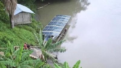 River boat with panels on top