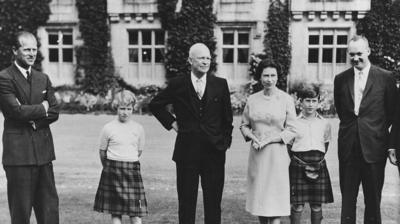 Black and white photo of President Eisenhower at Balmoral with the Royal Family.