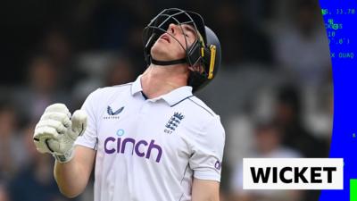 England's Dan Lawrence reacts after being caught out