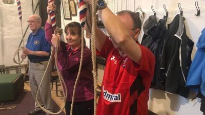 Bell ringers prepare bells at St Mary's Priory Church