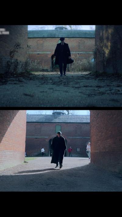 Two images show the same walkway between tall brick walls, taken from similar angles but in different lighting and seasons. In both shots, a single person wearing dark clothing walks toward the camera from the archway of a brick building in the background. The top image looks darker and more overgrown, while the bottom image is brighter, with clearer ground and a few other people visible in the distance.