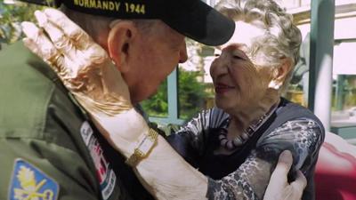 KT Robbins and Jeannine Pierson née Ganaye embracing