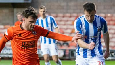 Dundee United's Ryan Strain and Kilmarnock's Liam Polworth