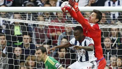 West Brom's Saido Berahino challenges Sunderland goalkeeper Costel Pantilimon