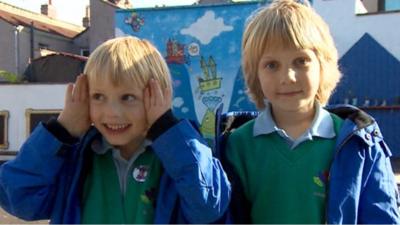 Twins brothers in playground