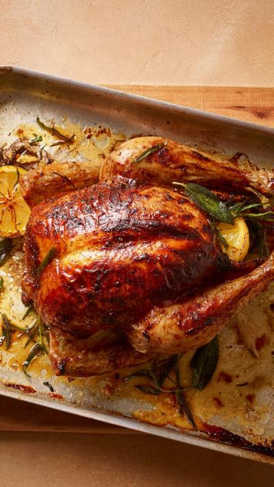 Top down view of a whole chicken in a roasting tin 