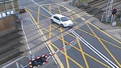 Car avoiding closing barriers