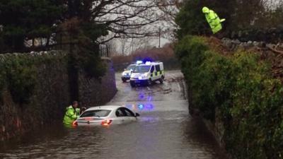 Car stuck in flood water in Gwynedd