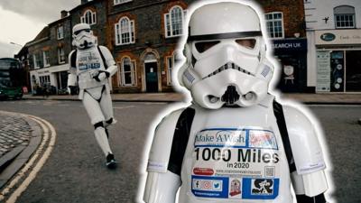 A stormtrooper runs through a town