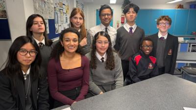 Nina with school children and the person in charge of online safety in the UK, MP Kanishka Narayan.