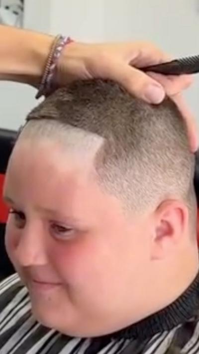 Young boy with a shaved head