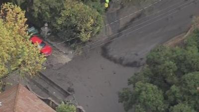 A river of mud rolls through the streets in southern California