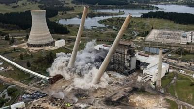 Chimneys fall in power plant demolition