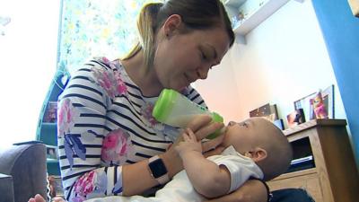 Leah feeding her baby