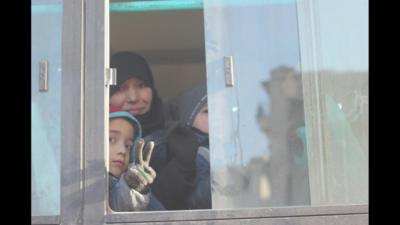 A family leaving Eastern Aleppo