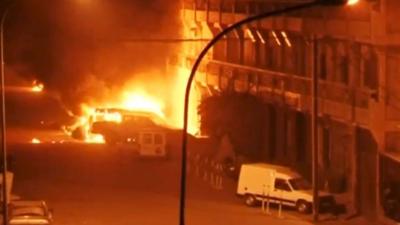 Vehicles on fire outside Splendid Hotel in Ouagadougou, during a siege by Islamist gunmen.