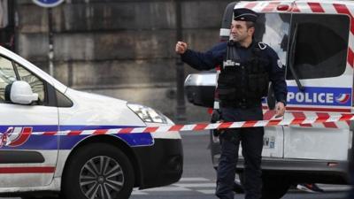 Officer outside Louvre