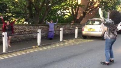 Residents dancing in the street