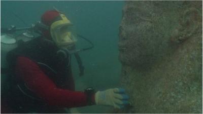 Diver and statue