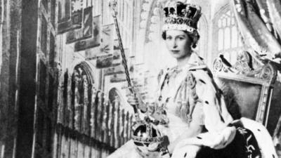 Queen Elizabeth II poses with the royal sceptre on 2 June 1953 after being crowned