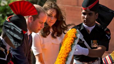 Prince William and his wife Catherine, the Duchess of Cambridge, place a wreath as they pay their tributes at the India Gate war memorial in New Delhi