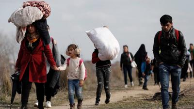 Refugees and migrants gather at the Turkish-Greek land border