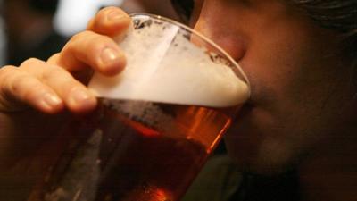 young man drinks beer