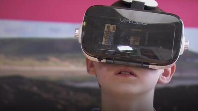 Young boy patient wearing virtual reality headset