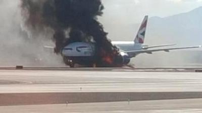Plane ablaze on runway