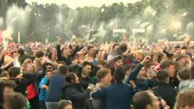 Wales fans in Cardiff's fanzone celebrate Wales' third goal against Belgium in the Euro 2016 semi-final