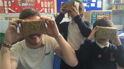 Martin and pupils using VR headsets