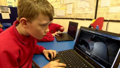 Young boy carries out Antarctic citizen science (c) BBC News