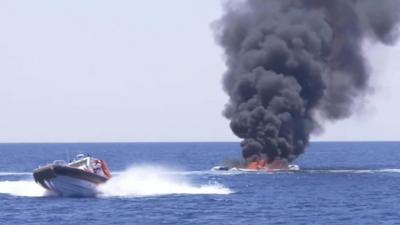 Smugglers' ship on fire in the Mediterranean Sea