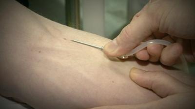 A person donating blood