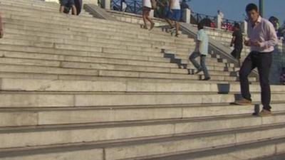 Mark Lobel on steps in Greece