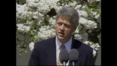 US President Bill Clinton speaks at a conference.