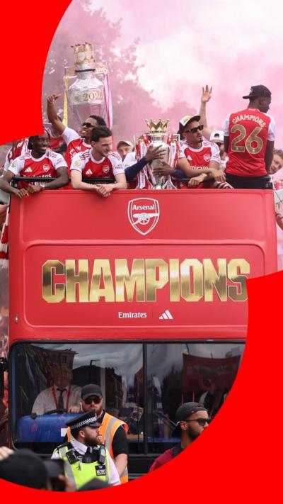The Arsenal team in open-topped buses holding trophies. Word Champions is written in front of the bus