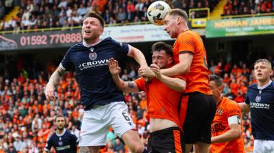 Dundee's Jordan McGhee and Dundee's Will Ferry (C) and Kevin Holt (R) 