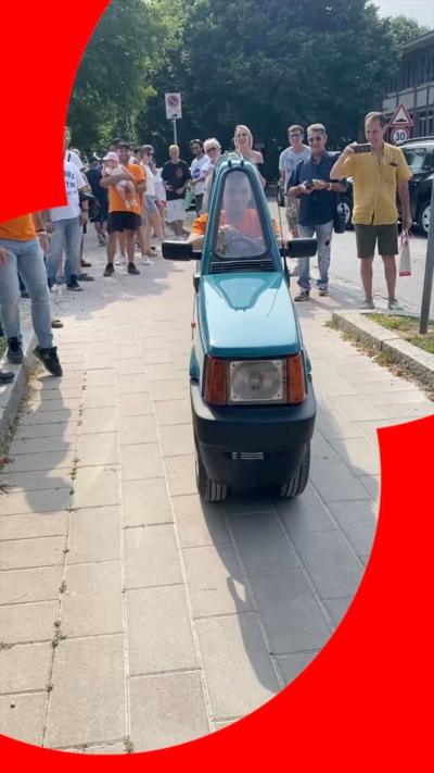 A dark green Fiat Panda that's been reduced to 50cm in width