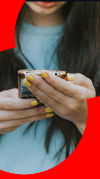 A woman holding a phone