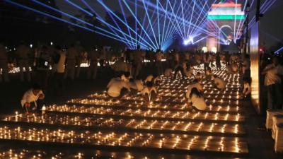 People light oil lamps in New Delhi, India, on the Kartavya Path