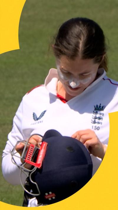 Tammy Beaumont after getting hit in the helmet 