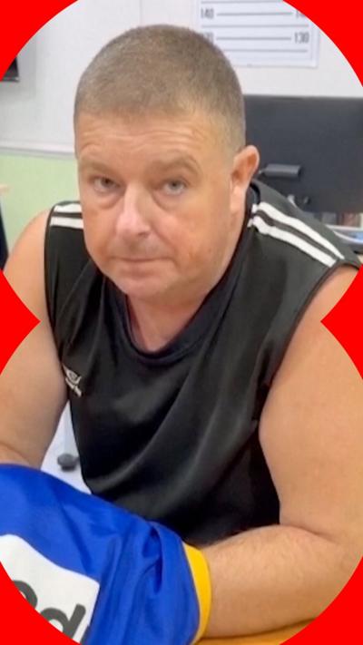 Australian man sitting at a table in a police station in Thailand