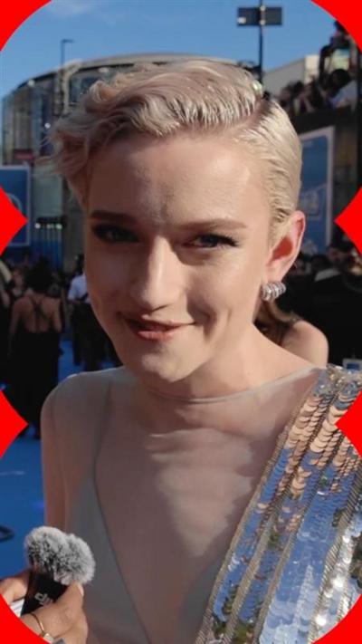 Julia Garner, with short blonde hair and silver sequins, at the Fantastic Four premiere