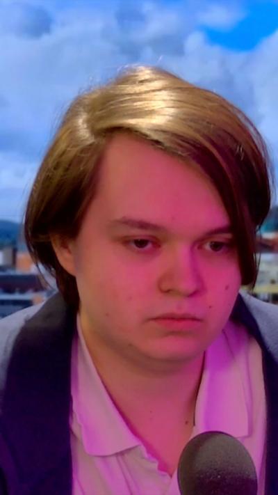 A man sits in a studio