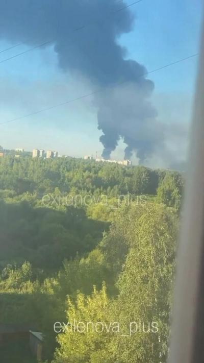 Smoke bellows in distance