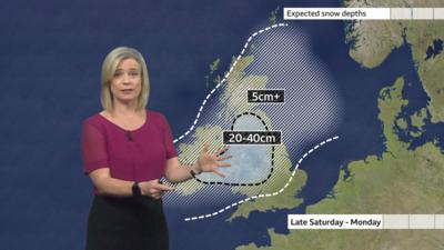 BBC Weather presenter Sarah Keith-Lucas stands in front of a map showing a lot of northwest England expecting snow this weekend.